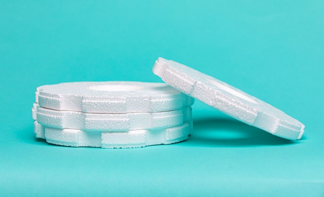 Custom molded white EPS foam rings manufactured by Clyde Foam
